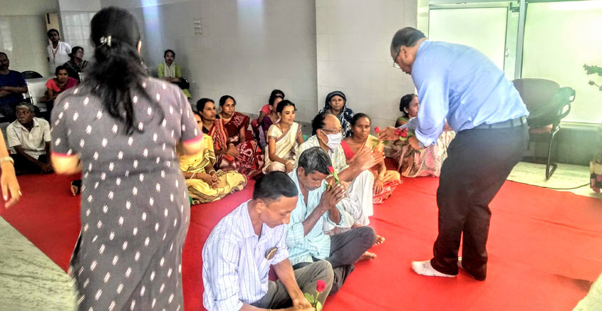 Roses being distributed to patients and caregivers by Assam Cancer Care Foundation representatives as part of World Rose Day 2019 celebrations